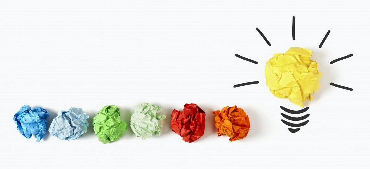 colour paper balls forming lightbulb idea