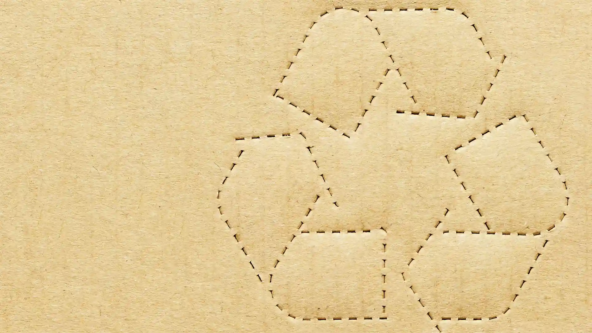Recycling Symbol Cutout on Brown Cardboard Background Recycling Symbol Cutout on Brown Cardboard Background