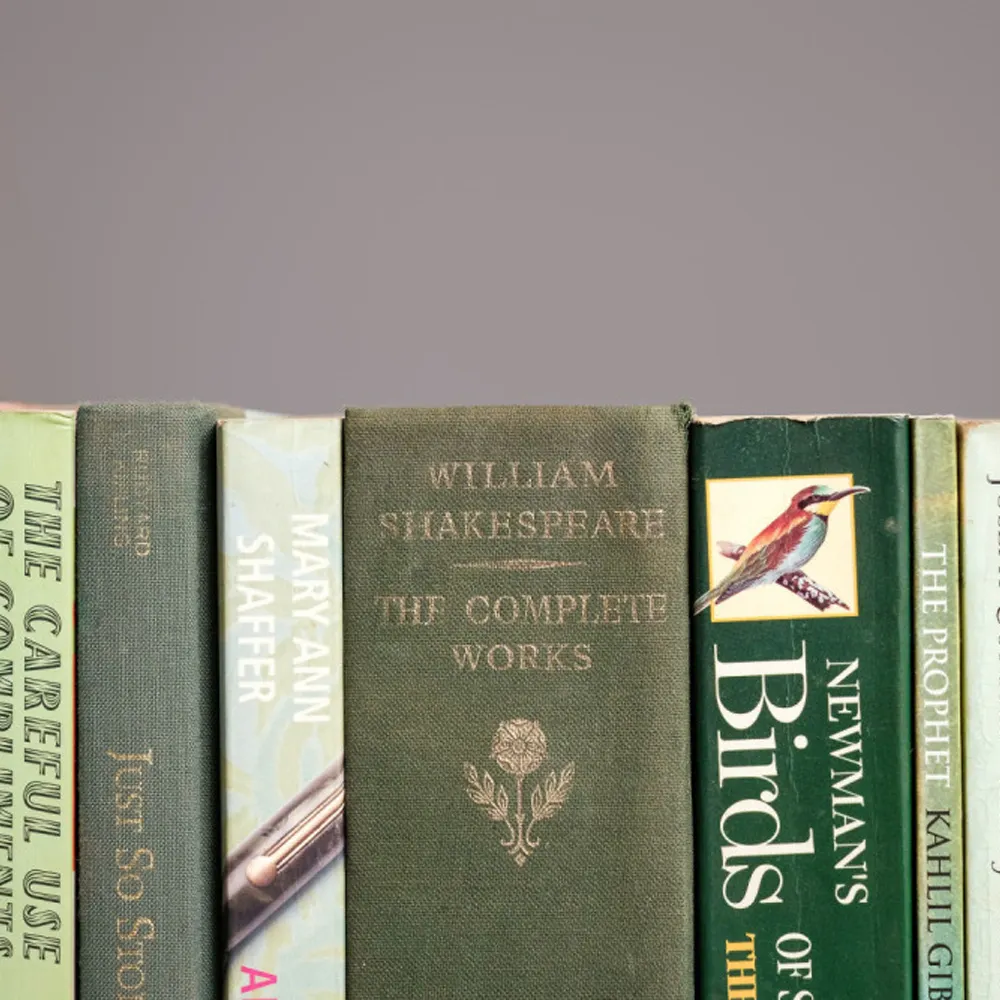 Shelf of Green Books with Literary and Nature Themes Shelf of Green Books with Literary and Nature Themes