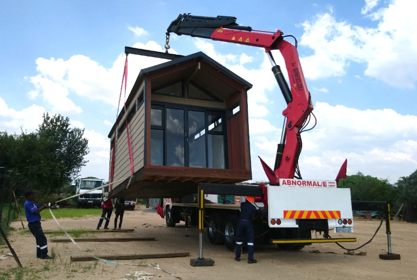 Timber-frame homes and isolation units could be mass produced in panel form and speedily erected by an existing construction workforce. Credit: Eco Log Homes