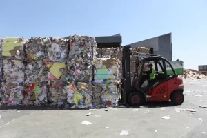 forklift-stacking-baled-recycled-cardboard-yard forklift-stacking-baled-recycled-cardboard-yard