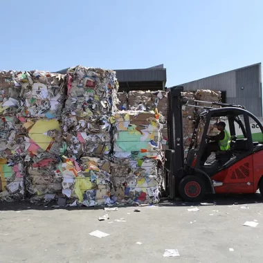 forklift moving large paper recycling bales forklift moving large paper recycling bales