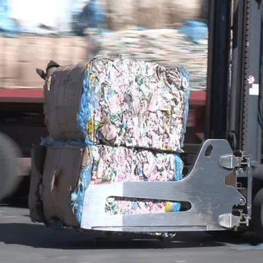 forklift transporting compressed paper bales forklift transporting compressed paper bales