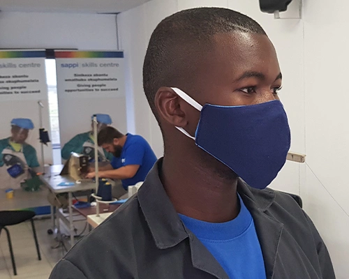 man wearing face mask in training workshop