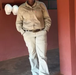 worker in khaki uniform standing indoors