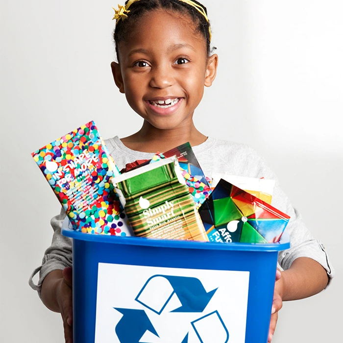 Little-girl-recycling-cartons-Credit-Tetra-Pak